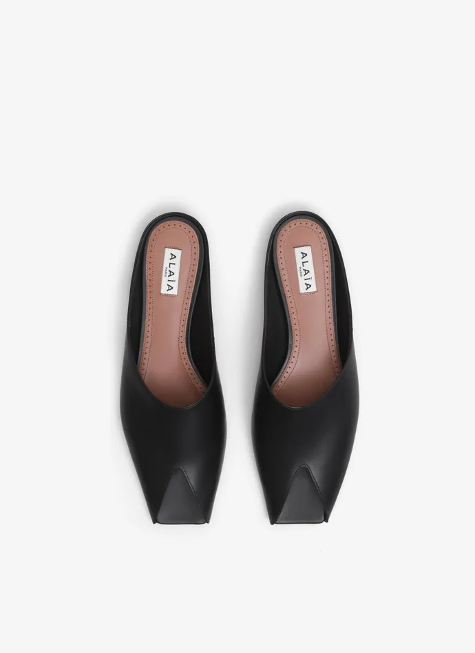 Black SPIKE FLAT MULES IN CALFSKIN Women Alaa Flat Shoes